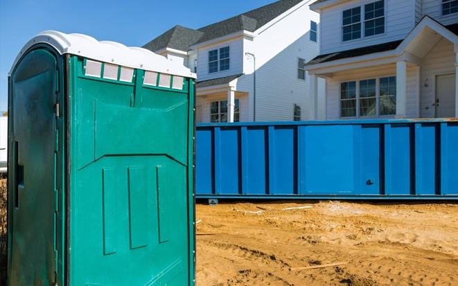 portable toilet and dumpster at a construction site project in New Braunfels TX